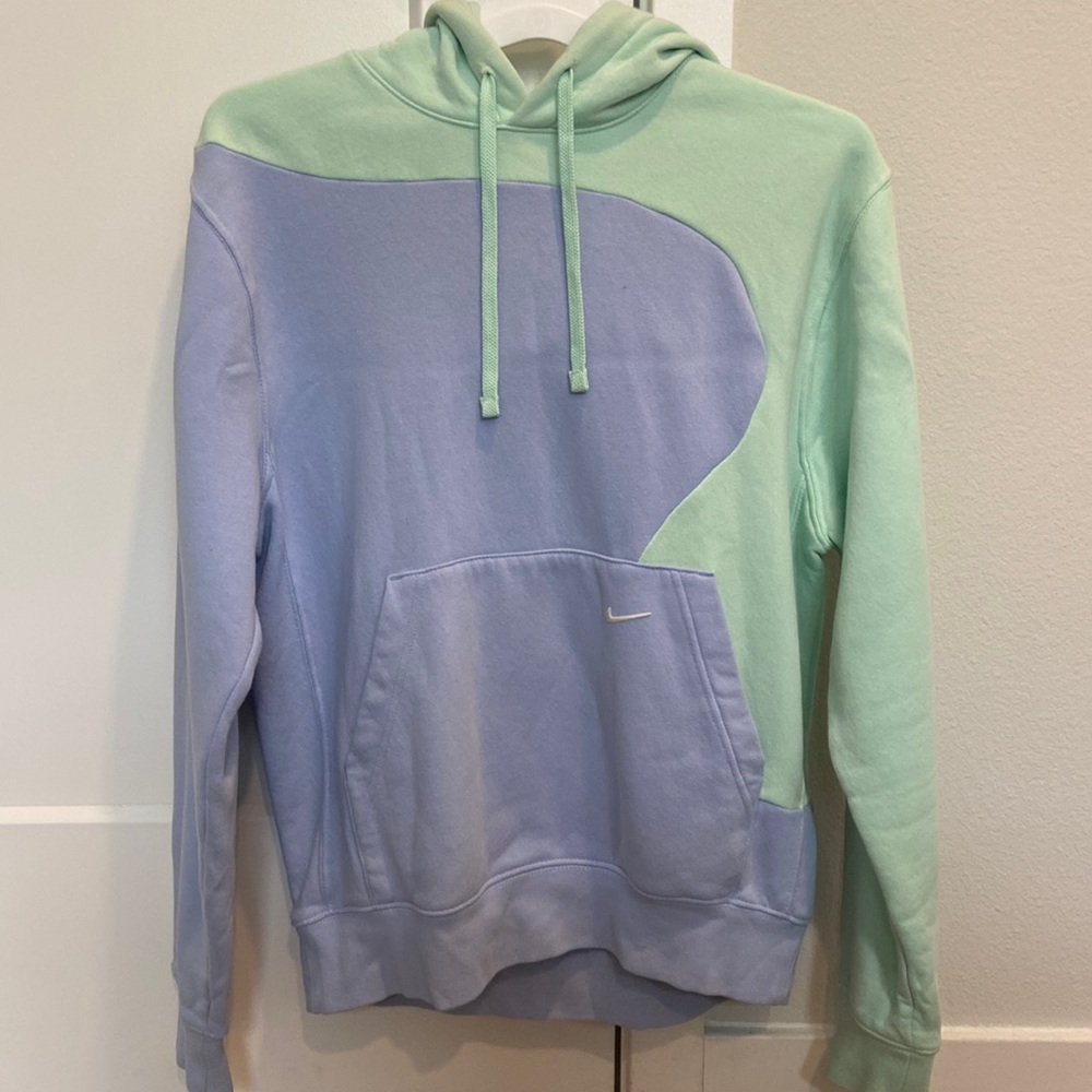 Periwinkle and sea foam green Nike hoodie.